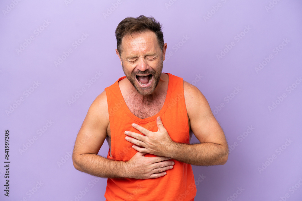 Middle age caucasian man isolated on purple background smiling a lot Middle age caucasian man isolated on purple background smiling a lot