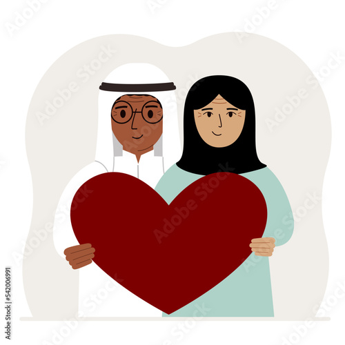 Happy man and woman holding a big red heart in their hands. Love