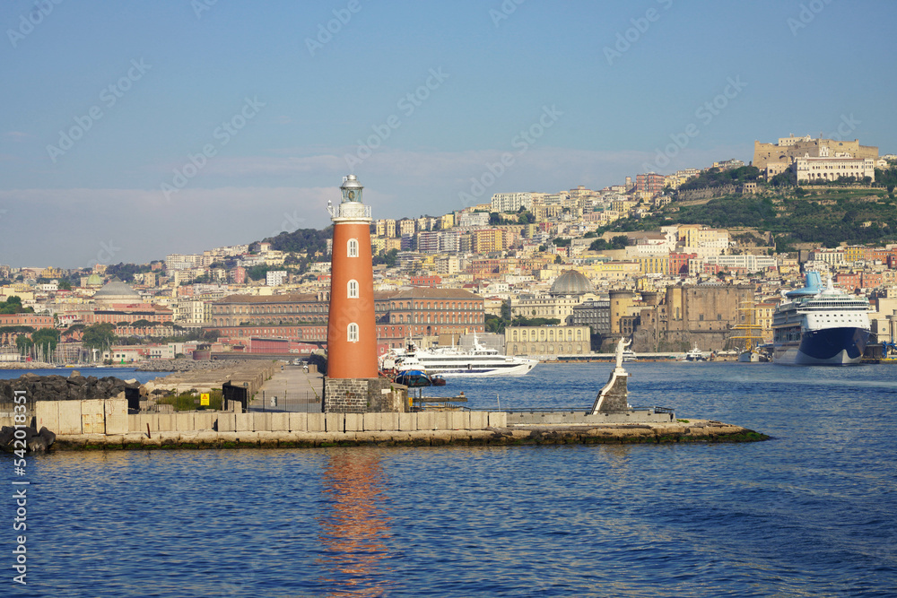 Naples lighthouse with marina and cityscape, Italy