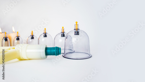 Fotografía equipment for vacuum cupping massage - cupping pump and a set of cups for vacuum