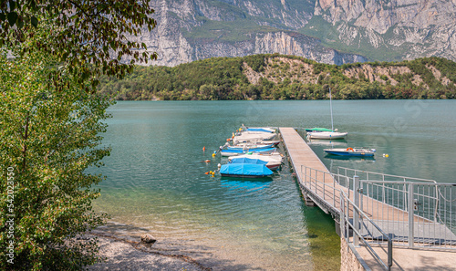 Jetty and small boats at Tourist destination of the Cavedine Lake  Trento province - Trentino Alto Adige  northern Italy - august 26  2022