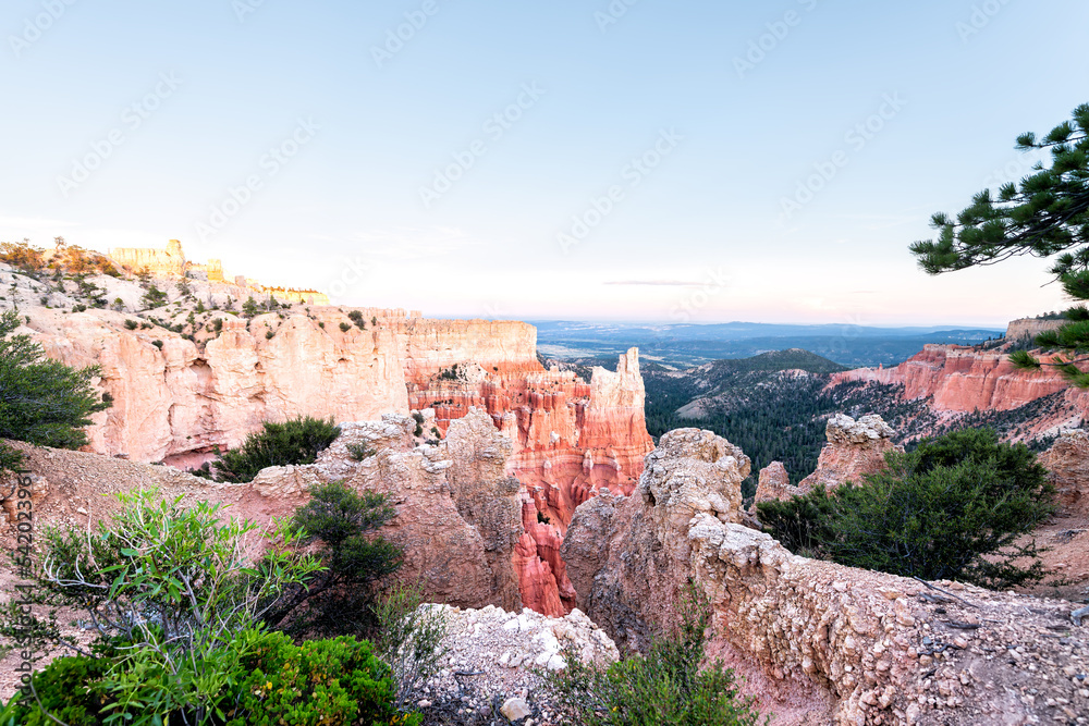 Aerial Paria point view overlook on orange colorful hoodoos red rock formations in Bryce Canyon National Park at sunset with rocks in foreground