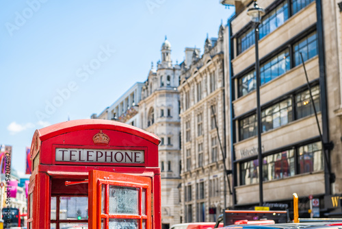 Fotografie, Obraz European red telephone phone box booth closeup with opened door in London, Unite