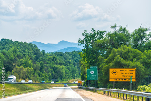 Virginia interstate highway 81 road with traffic cars trucks in summer, scenic view of Blue ridge mountains in Botetourt county, Arcadia town village photo