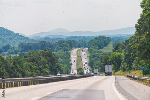 Virginia interstate highway i81 81 road with traffic cars trucks in summer, scenic view of Blue ridge mountains photo