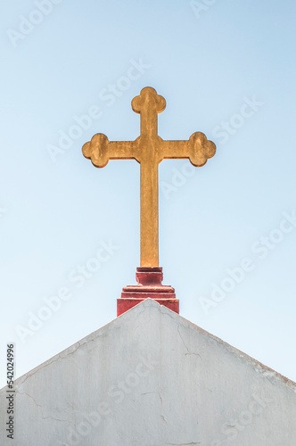 Catholic cross on the roof of a house Jerez de la Frontera, Cadiz, Andalucia
 photo