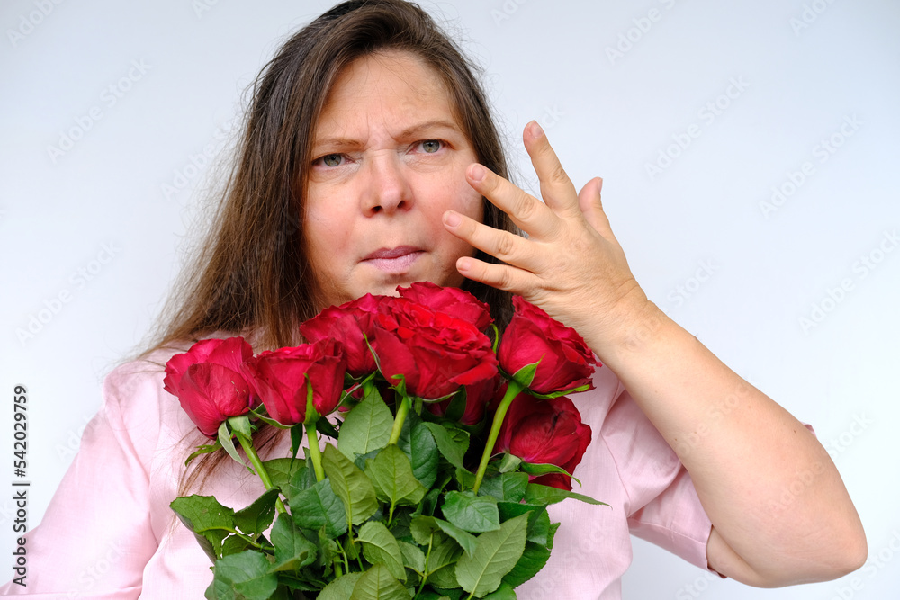 bouquet of flowers, red roses, middleaged woman 50 years old with