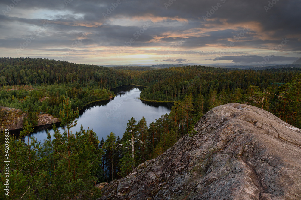 Northern landscape, blue lakes among the Spruce forest. The nature of the Karelian Isthmus and the rocks of the Triangular Lake, view from the top
