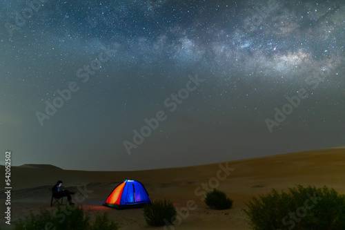 Milky way night sky in desert sand dune, night off road night camping.
