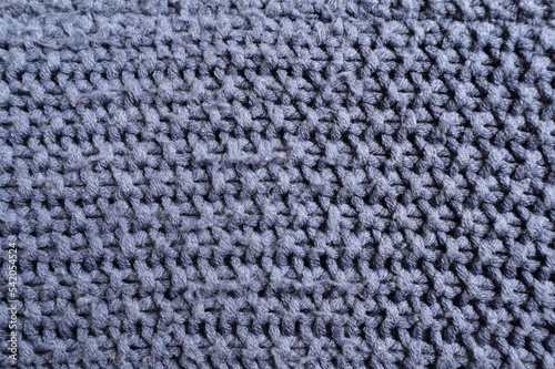 Wool knitted fabric of gray color, use for background.	