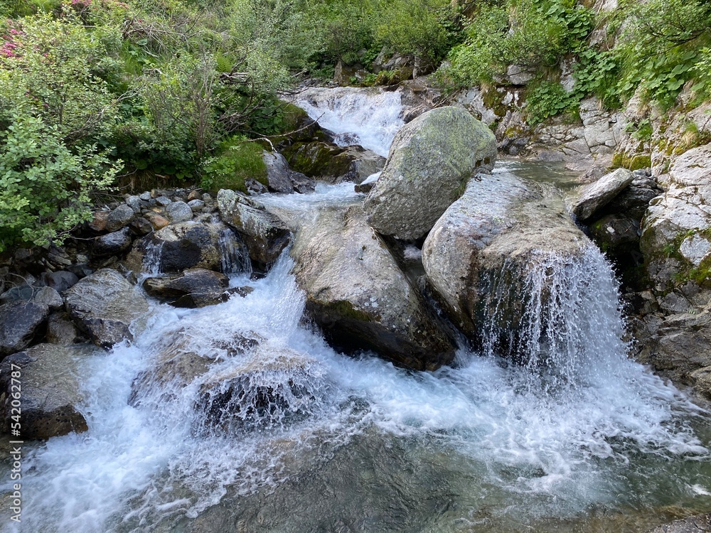 Waterfalls and cascades on the alpine stream Guspisbach in the Swiss Alps and in the area of the mountain St. Gotthard Pass (Gotthardpass), Airolo - Canton of Ticino (Tessin), Switzerland (Schweiz) Waterfalls and cascades on the alpine stream Guspisbach in the Swiss Alps and in the area of the mountain St. Gotthard Pass (Gotthardpass), Airolo - Canton of Ticino (Tessin), Switzerland (Schweiz)