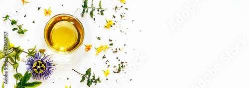 Calming herbal tea with passiflora leaves on white background with copy space. Long banner photo
