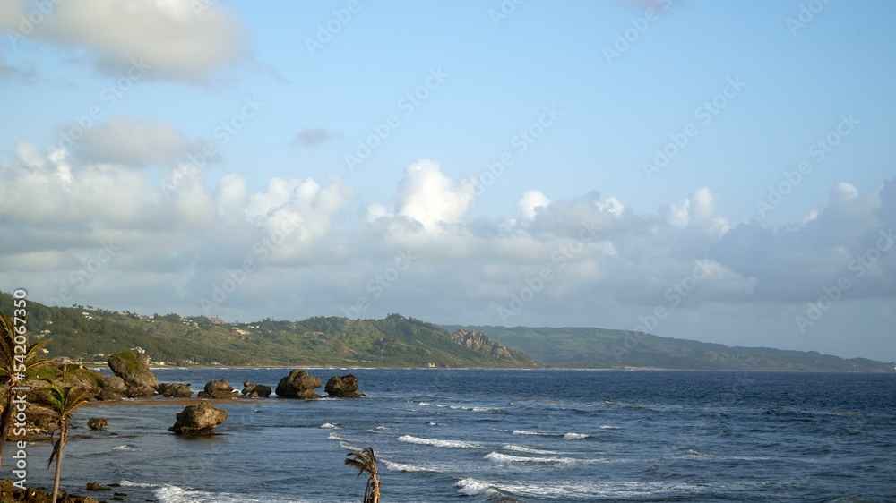 Beautiful view of rocks in a calm sea under the blue sky