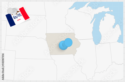 Map of Iowa with a pinned blue pin. Pinned flag of Iowa.