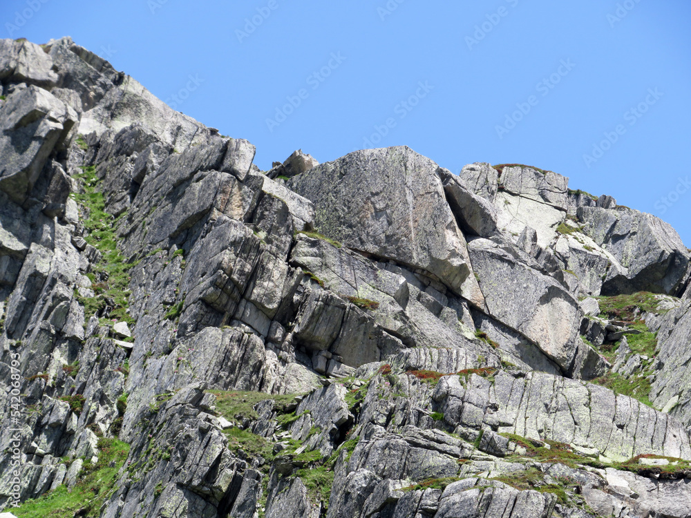Rocks and stones in the summer Swiss Alpine environment and in the St. Gotthard pass (Gotthardpass) mountain area, Airolo - Canton of Ticino (Tessin), Switzerland (Schweiz)