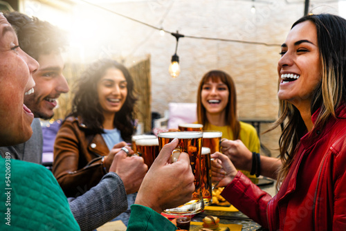 Canvas Print Happy group  friends cheering glasses beer in a bar restaurant-Smiling young peo