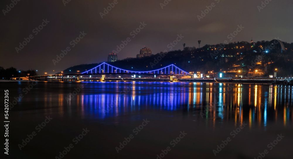 Night view of the bridge over the Dnieper river in Kiev. Kyiv at night and the Dnieper river