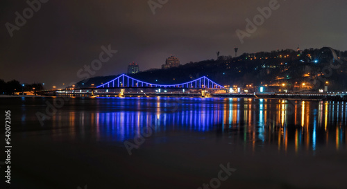 Night view of the bridge over the Dnieper river in Kiev. Kyiv at night and the Dnieper river