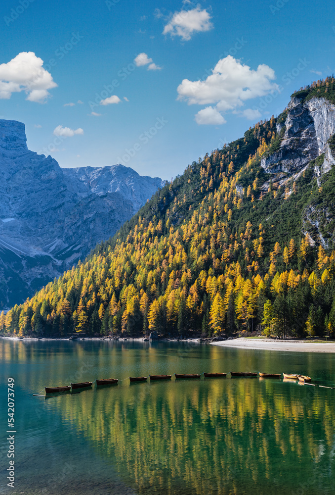 Autumn peaceful alpine lake Braies or Pragser Wildsee. Fanes-Sennes-Prags national park, South Tyrol, Dolomites Alps, Italy, Europe. Picturesque traveling, seasonal and nature beauty concept scene. Autumn peaceful alpine lake Braies or Pragser Wildsee. Fanes-Sennes-Prags national park, South Tyrol, Dolomites Alps, Italy, Europe. Picturesque traveling, seasonal and nature beauty concept scene.