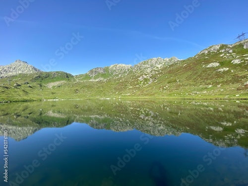 Summer atmosphere on the Lago di Rodont lake (Lake Rodont) in the Swiss alpine area of the mountain St. Gotthard Pass (Gotthardpass), Airolo - Canton of Ticino (Tessin), Switzerland (Schweiz)
