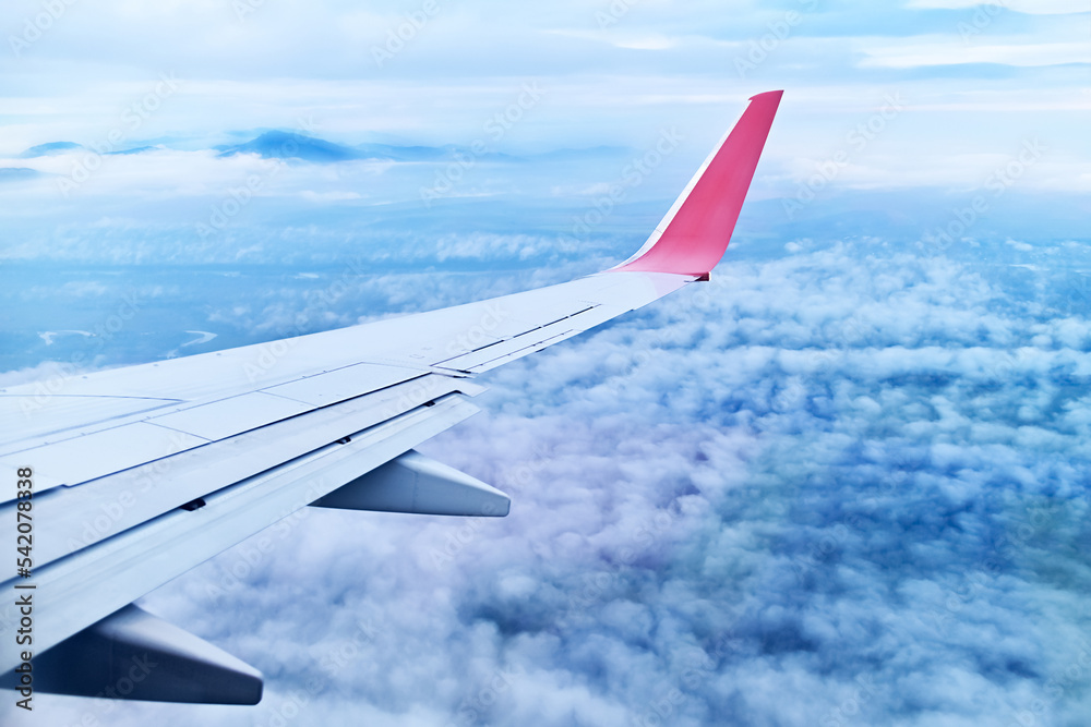 view of the clouds from the plane window. view of the clouds from the plane window.