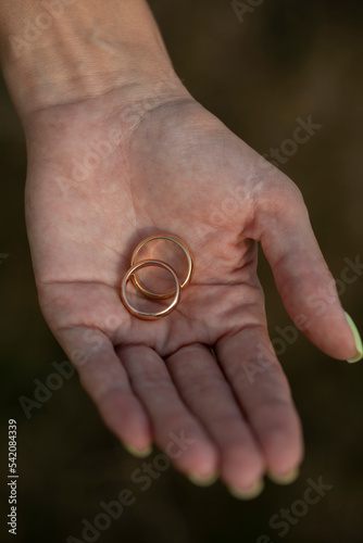 wedding rings in hands