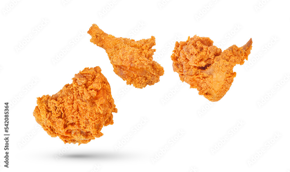 Fried chicken falling in the air isolated on white background. Fried chicken falling in the air isolated on white background.