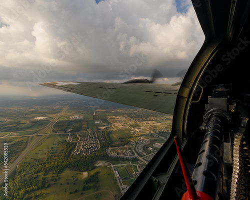 in flight view of the left gunners station of  B-17 Flying fortress Texas Raiders in flight photo