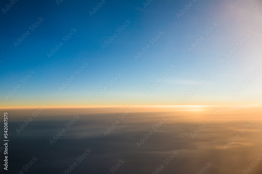 Aerial shots taken from airplane window during sunset.