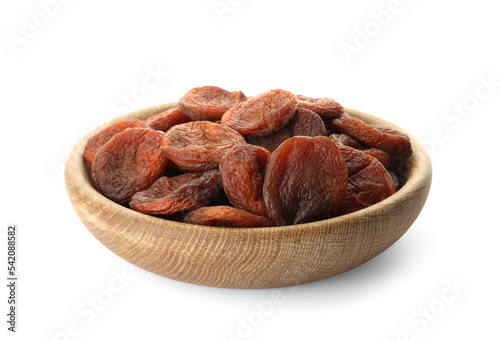 Wooden bowl with tasty dried apricots isolated on white