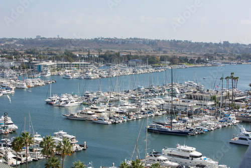 Marina Del Rey, California, USA – October 12, 2022: High Close-up View of Yacht Clubs at Marina Del Rey with Beach, Boat Pier Docks, Boats, and Houses © HunYoung