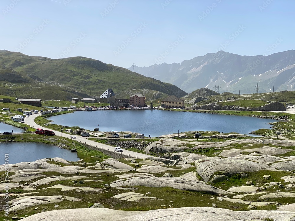 Summer atmosphere on the Lago della Piazza lake (Lake of the Piazza) in the Swiss alpine area of the mountain St. Gotthard Pass (Gotthardpass), Airolo - Canton of Ticino (Tessin), Switzerland (Schweiz