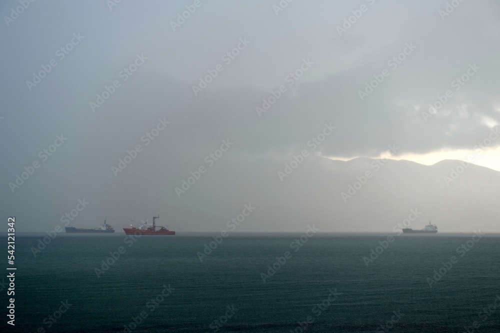 Sea vessels sheltering from the storm on the roadstead in the Novorossiysk Bay of the Black Sea