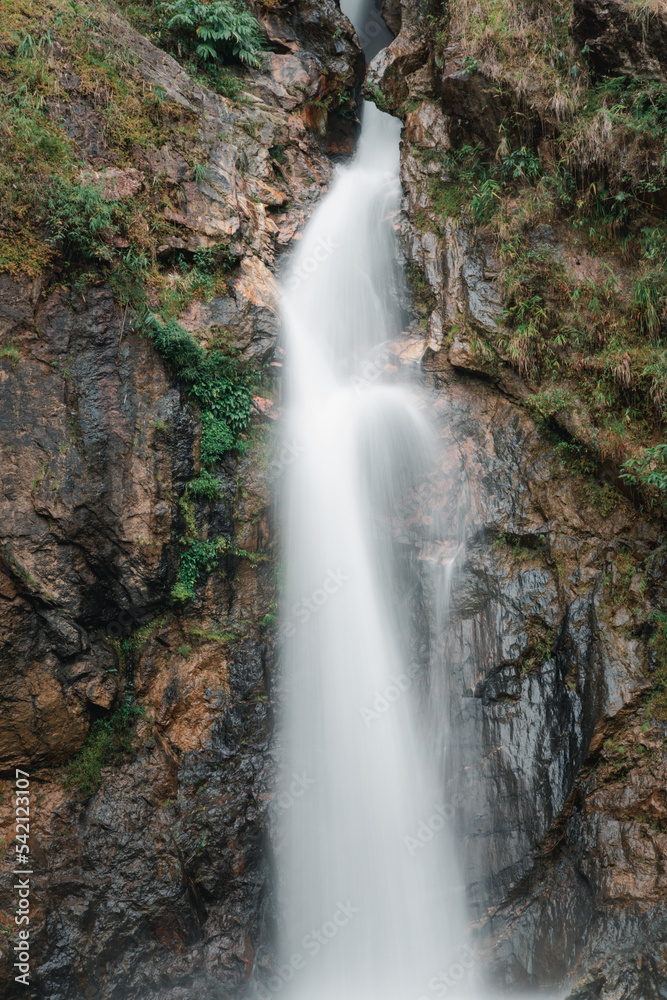 Landscape of beautiful waterfall on high mountain.