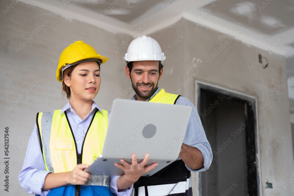 Engineers on building site. Engineer are working contruction on site plans to build high-rise buildings building. Architect caucasian man working with colleagues mixed race in the construction site. Engineers on building site. Engineer are working contruction on site plans to build high-rise buildings building. Architect caucasian man working with colleagues mixed race in the construction site.