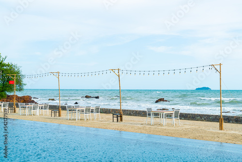 dinning table and chair on beach with sea background