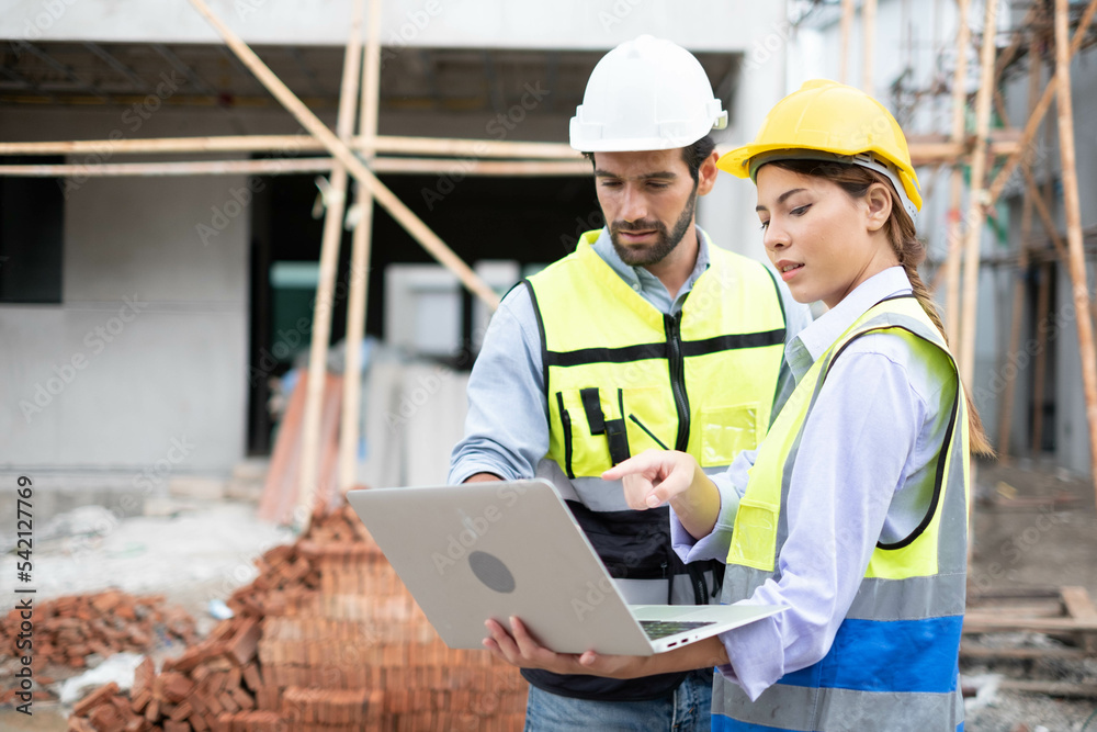 Engineers on building site. Engineer are working contruction on site plans to build high-rise buildings building. Architect caucasian man working with colleagues mixed race in the construction site. Engineers on building site. Engineer are working contruction on site plans to build high-rise buildings building. Architect caucasian man working with colleagues mixed race in the construction site.