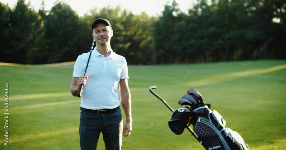 Closeup portrait of handsome young male golfer with golf club. High quality 4k footage Closeup portrait of handsome young male golfer with golf club. High quality 4k footage