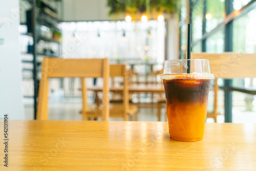 iced black coffee with yuzu cup on table