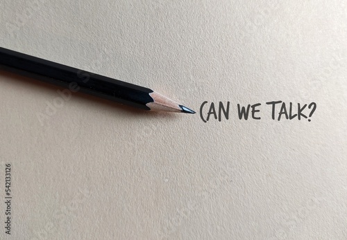 Pencil on copy space craft paper with text written CAN WE TALK?, concept of boss , manager, partners or friends approach to have a serious talk or difficult conversation to solve conflicts or relation