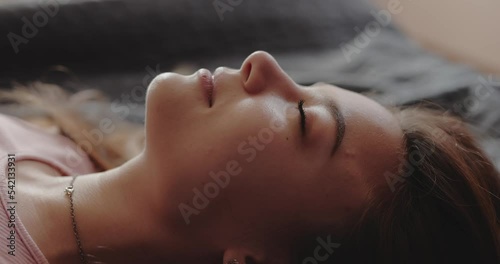 Close-up face of woman pretending to sleep, fake dream