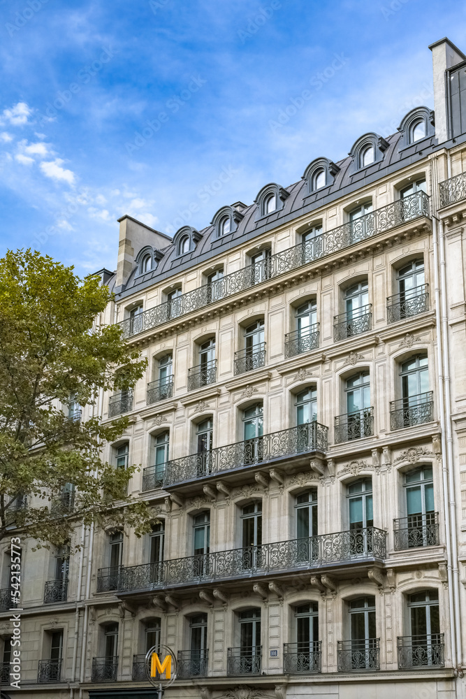 Paris, beautiful building, ancient facade boulevard Hausmann
