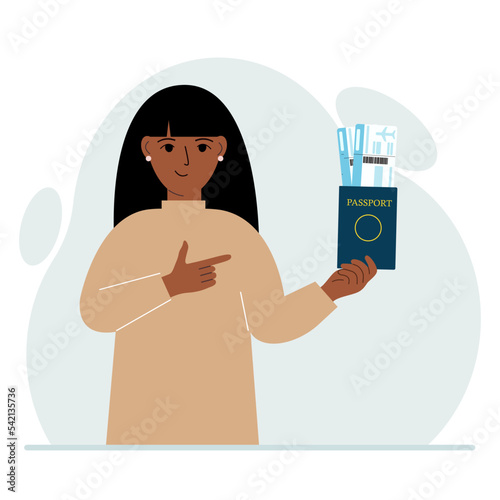 A woman holds a passport with air tickets. The woman shows the boarding pass. Travel concept.