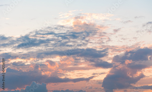 Delicate sunrise in the sky with clouds. Copy space. Cloudy background