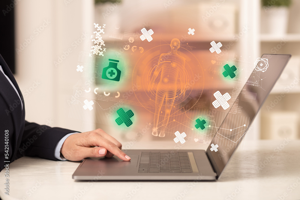 Doctor working on laptop with healthcare concept Doctor working on laptop with healthcare concept