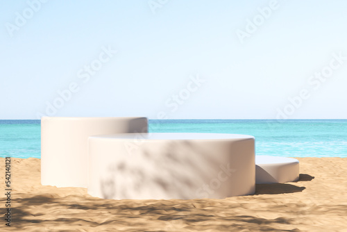 White podiums at the beach, ocean view. Mockup for product display