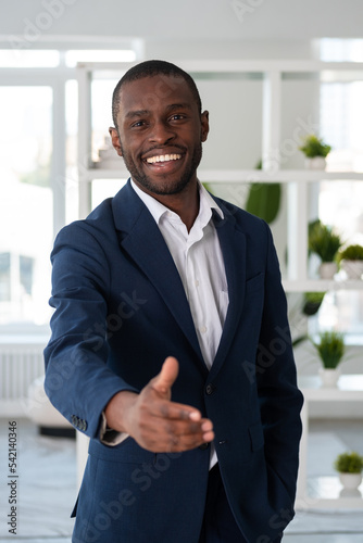 African American businessman wearing formal suit standing stretc
