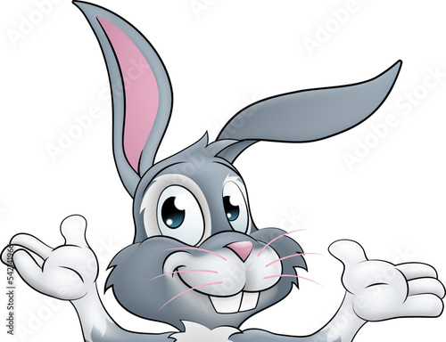 An Easter bunny rabbit cartoon character peeking around a sign