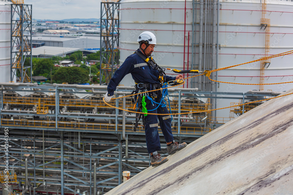 Male workers clear rope access wearing safety first harness rope safety line