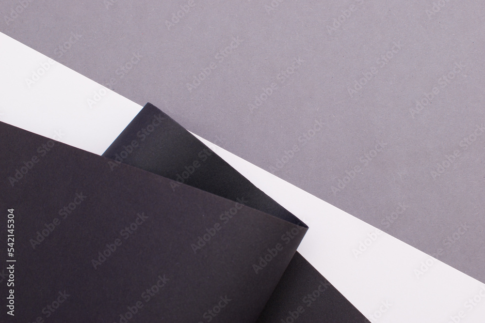 White, black and gray curved divided background White, black and gray curved divided background